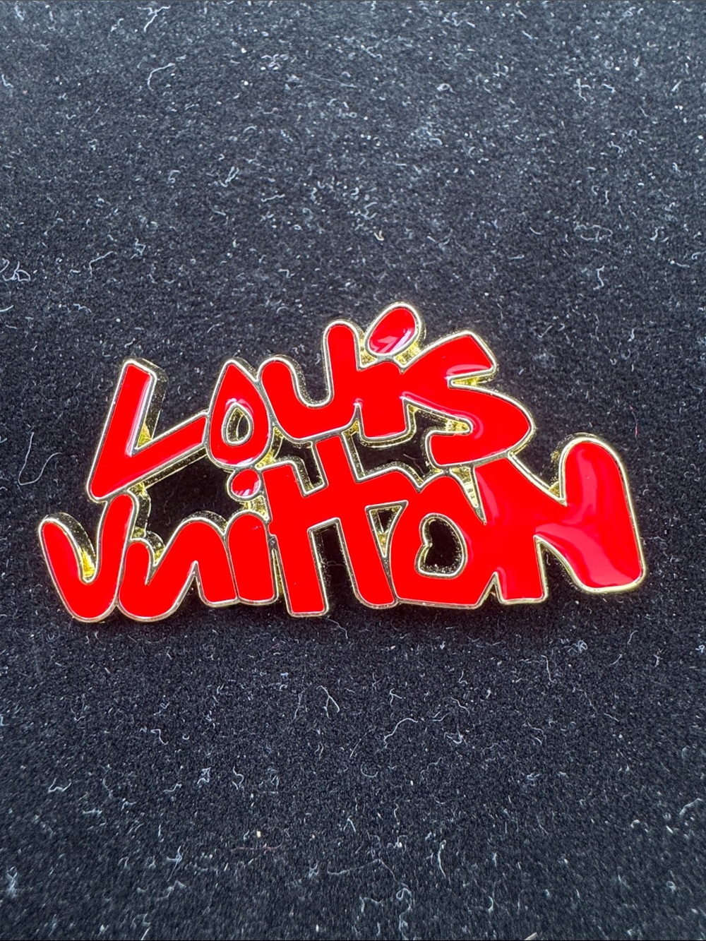 Brooch Red Script